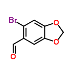 InChI=1/C8H5BrO3/c9-6-2-8-7(11-4-12-8)1-5(6)3-10/h1-3H,4H2